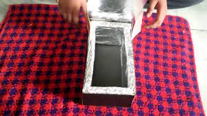 a solar cooker with shoe box