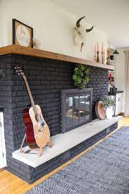 our black painted fireplace bright