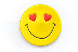 bright yellow sticker with a smiley