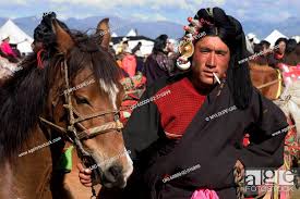 Khampa man & Tibetan pony wait for a chance to race at the Litang Horse  Festival - Kham, Stock Photo, Picture And Rights Managed Image. Pic.  UIG-60000-02-316899 | agefotostock