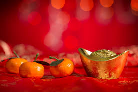 Celebrate chinese new year background with orange fruit for warship, red envelope and beautiful blossom. 8 Ways To Celebrate The Chinese New Year Even If You Re Not Chinese Parents
