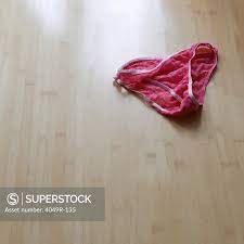 Close-up of panties on the floor - SuperStock