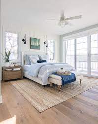 white and blue lake house master bedroom