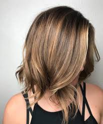 This style, for instance, features dynamic waves with jagged ends and subtle cherry highlights that will look even more incredible in bright sunlight. Long Bob Haircut For Thick Hair Novocom Top