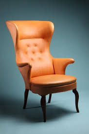 high backed wing chair designed by