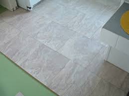I have tile squares in my bedroom. Installing Laminate Tile Over Ceramic Tile Diy Laminate Floors Wonderhowto