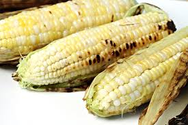 in their husks grilled corn on the cob