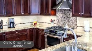 The black granite countertops with its subtle black and gray specks definitely pairs well with the black and gray glass mosaic tiles used on the backsplash. Top 5 Granites For Dark Cabinets Youtube