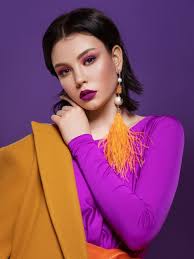 bright color makeup in a purple dress