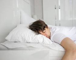 Image of person sleeping soundly in bed