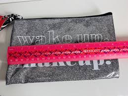 2 glitter makeup bags with cute sayings