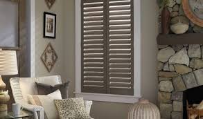 Matching striped roman blinds on twin windows introduce colour and pattern to an otherwise plain scheme. Window Blinds Vs Plantation Shutters How To Choose What S Best For You