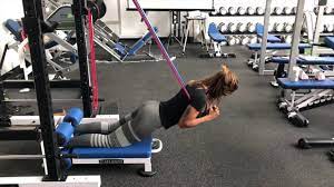 the floor glute ham raise with bands