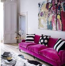 a hot pink velvet sofa is a bright