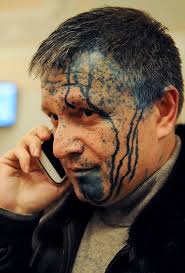 Ukrainian opposition parliament deputy Arsen Avakov talks on his phone in a courtroom after being sprayed - Ukraine-Politician_033860361896