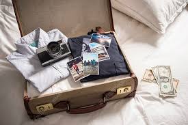 open suitcase on bed stock image
