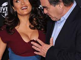 Oliver Stone's hand and Salma Hayek's boobs get up close and personal -  Picture - Mirror Online