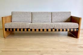 Dramatic Sofa With Leather Straps