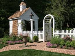 White Picket Fence With Rose Arbor