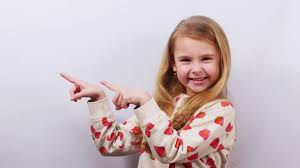 Little Girl With Natural Sincere Smile Pointing Aside Positive Kid