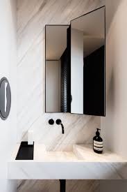 The black wall mount faucet and sleek brass pendants round out the refined vibe. 16 Perfect Marble Bathrooms With Black Fixtures