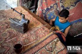 child labour carpet stock photos and