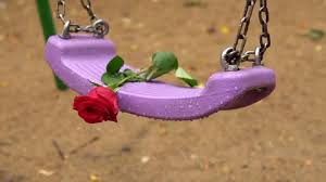 Single Empty Swing With Red Rose In