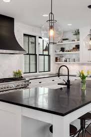 Black quartz countertops also accentuate subtle colors in painted cabinets, such as the white cabinets and crackle subway tile in this kitchen by eric aust architect. 50 Black Countertop Backsplash Ideas Tile Designs Tips Advice