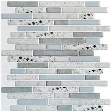 You can simply stick it over your hideous backsplash for a year or two, and pull it up when it's time to go! Art3dwallpanels 12 In X 12 In X 0 06 In Azure Grey Peel And Stick Backsplash Tile For Kitchen Bathroom 10 Tiles Pack H17hd085 The Home Depot