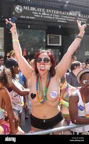Spectator flashes breasts at the 45th annual New York City Pride Parade on  Fifth Avenue Stock Photo - Alamy