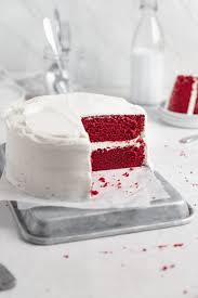 Red velvet cheesecake cake with layers of moist red velvet cake and creamy cheesecake, covered in cream cheese frosting! Red Velvet Cake Broma Bakery