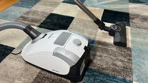 compact canister vacuum review miele