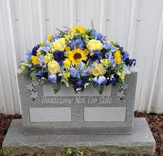 Scotchgard made for silk flowers was applied to arrangement to help. Blue Yellow Summer Cemetery Headstone Saddle Grave Headstone Flowers Grave Flowers Grave Saddle Cemetery Flowers Cemetery Saddle Sunflower Cemetery Flowers Memorial Flowers Cemetery Headstones