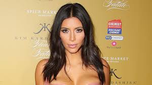 kim kardashian shows off flawless tan