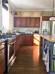 There are no significant cost to reduce your cabinet refacing cost, consider including your existing doors with wood veneer or laminate over. Building Cabinets Up To The Ceiling From Thrifty Decor Chick