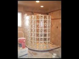 a glass block curved shower wall