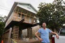 heights remodeler jacks up house to add