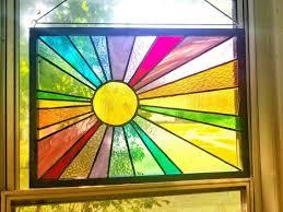 rainbow sunburst stained glass window
