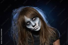 zombie makeup over dark background