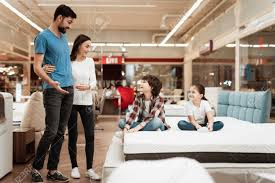 Shop value city furniture today. Happy Family With Children Came In Furniture Store To Buy Mattress Stock Photo Picture And Royalty Free Image Image 97679891