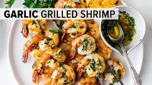 The marinade may turn cloudy in the refrigerator as the oil solidifies, so let the shrimp stand at room temperature for 10 minutes before serving. Garlic Grilled Shrimp Skewers Downshiftology