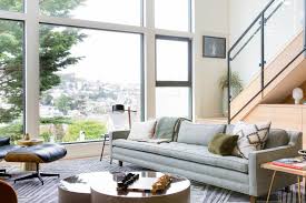 There are two big windows with blue curtains. Neutral Contemporary Living Room With Big Windows Hgtv