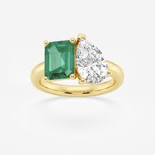 9x7mm created emerald and 2 3 8 pear cut lab grown diamond two stone enement ring 14k yellow gold