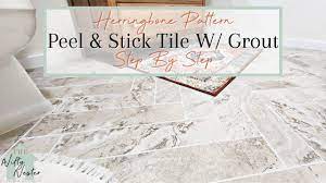 herringbone tile bathroom floor