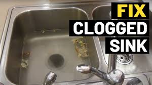 how to fix clogged kitchen sink that
