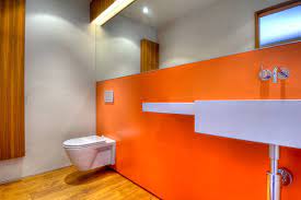 deluxe neon orange bathroom wall