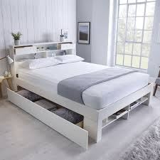 This stylish and functional platform storage bed comes with elegant tufted headboard, which metro series solid pine wood construction with partially engineer wood , caramel colour, drawers run on metal rails, brass coloured circular handles. Fabio King Size Storage Bed White Buy Online At Qd Stores