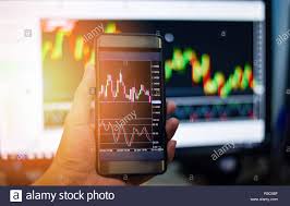 Businessman Trading Exchange Board Data On Mobile Screen