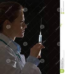 Silhouette Of Doctor Woman With Syringe On Black Background