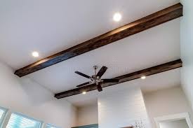 lights flanked by decorative wood beams